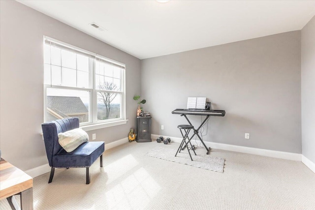 living area with carpet floors, visible vents, and baseboards