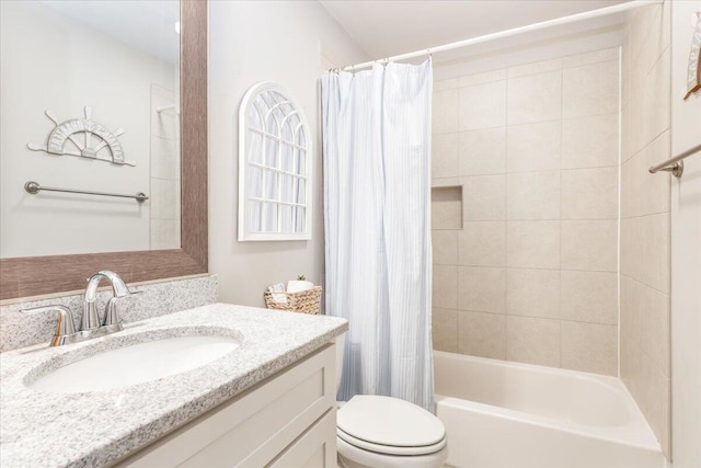 bathroom with shower / tub combo, vanity, and toilet