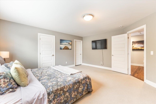 carpeted bedroom featuring baseboards