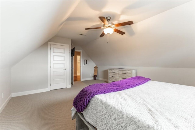 bedroom with light carpet, ceiling fan, baseboards, and vaulted ceiling