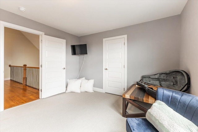 sitting room with carpet floors and baseboards