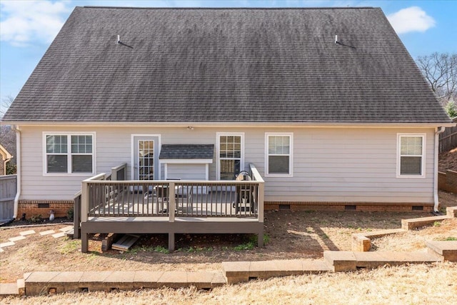 back of property with crawl space, a deck, and roof with shingles