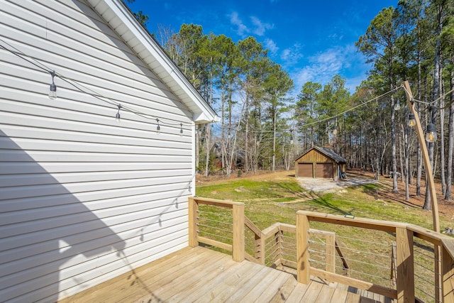 deck featuring a lawn and an outdoor structure