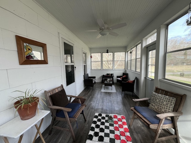 sunroom featuring wood ceiling and ceiling fan