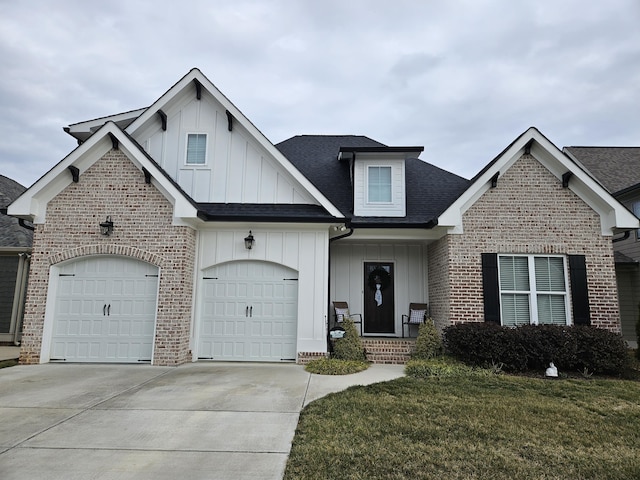 view of front of house featuring a front yard and a garage