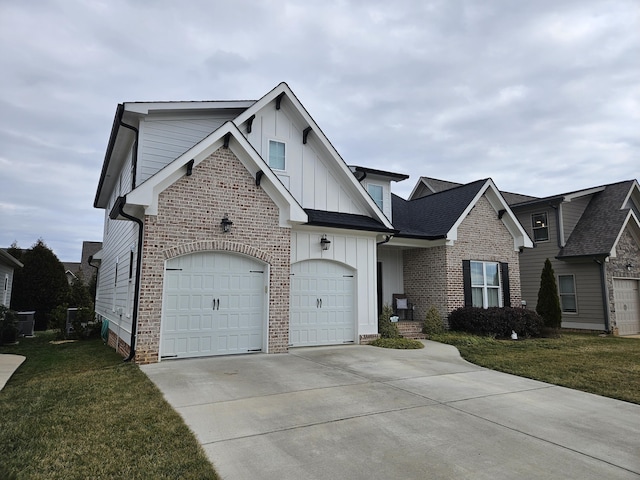 view of front of property with a front lawn and a garage