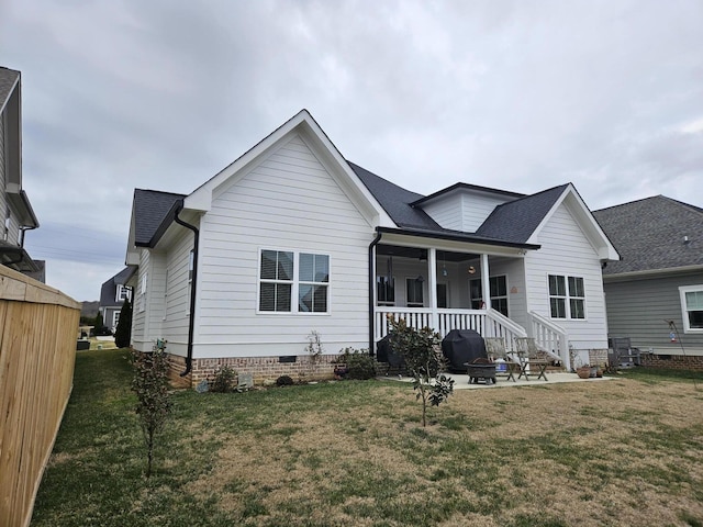 exterior space with a front yard and a patio