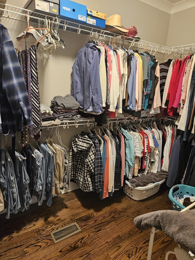 walk in closet featuring hardwood / wood-style floors