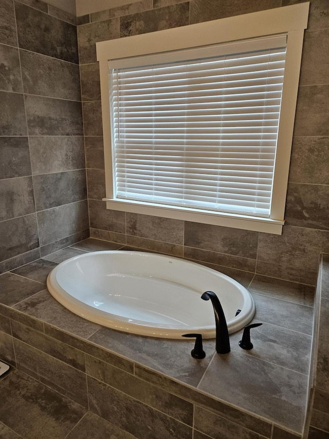 bathroom with tiled bath