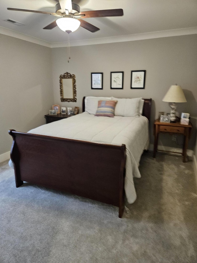 carpeted bedroom featuring ceiling fan and ornamental molding