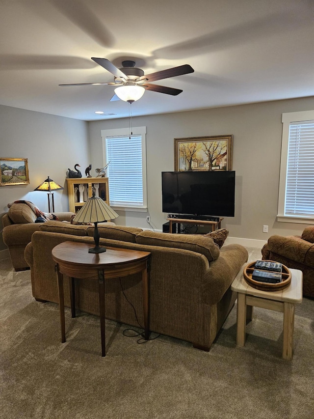 living room featuring ceiling fan and carpet flooring