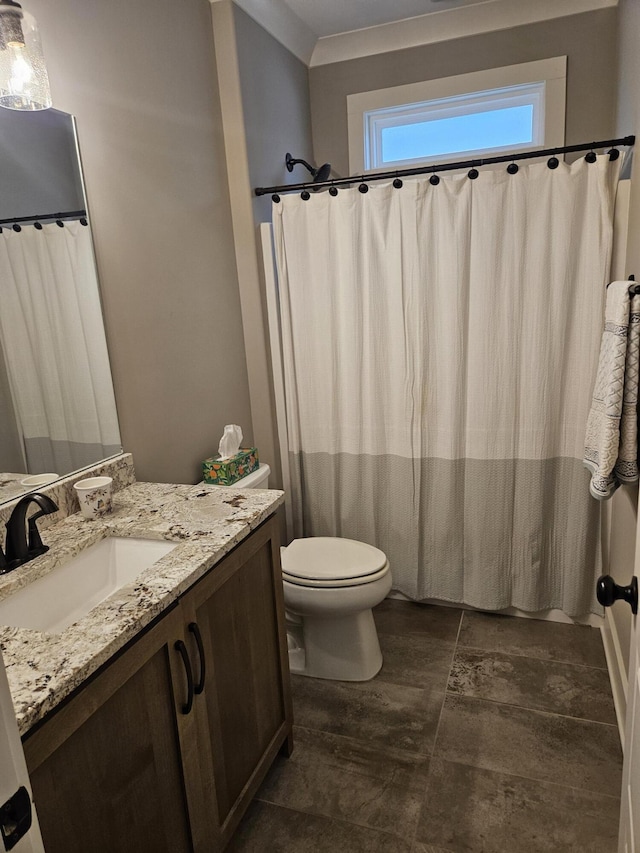 bathroom featuring toilet and vanity