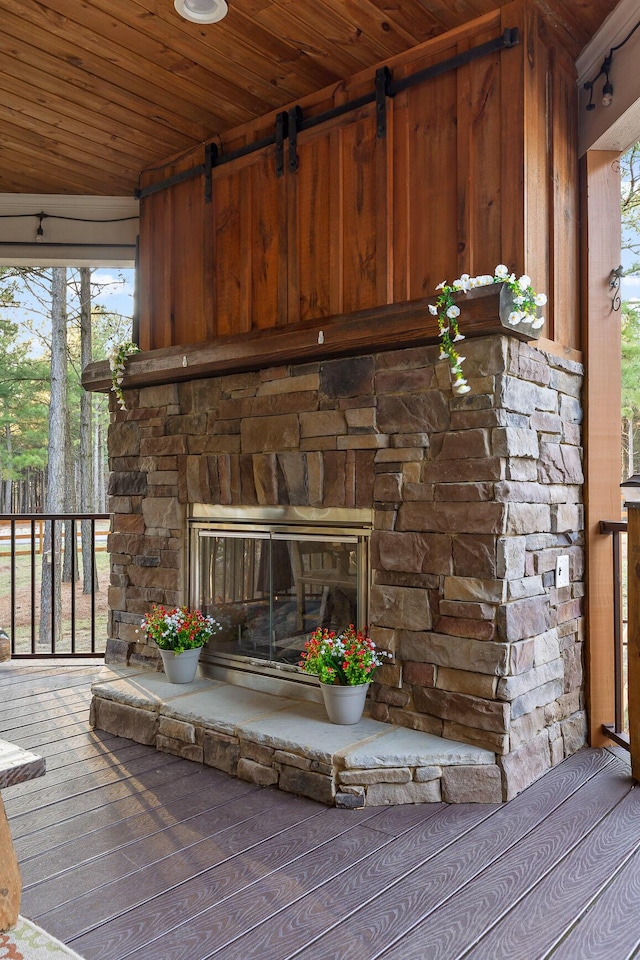 exterior details featuring an outdoor stone fireplace