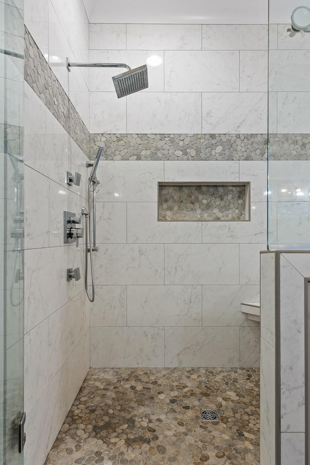 bathroom featuring an enclosed shower