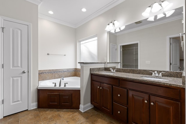 bathroom featuring ornamental molding, a bathtub, and vanity