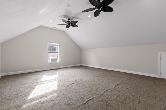 additional living space with cooling unit, ceiling fan, carpet flooring, and vaulted ceiling