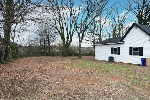 view of yard with central air condition unit