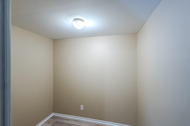 unfurnished room featuring hardwood / wood-style flooring