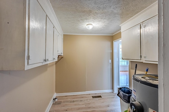 washroom featuring water heater, ornamental molding, a textured ceiling, and light wood-type flooring