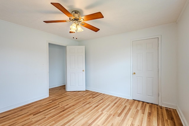 unfurnished bedroom with ceiling fan and light wood-type flooring