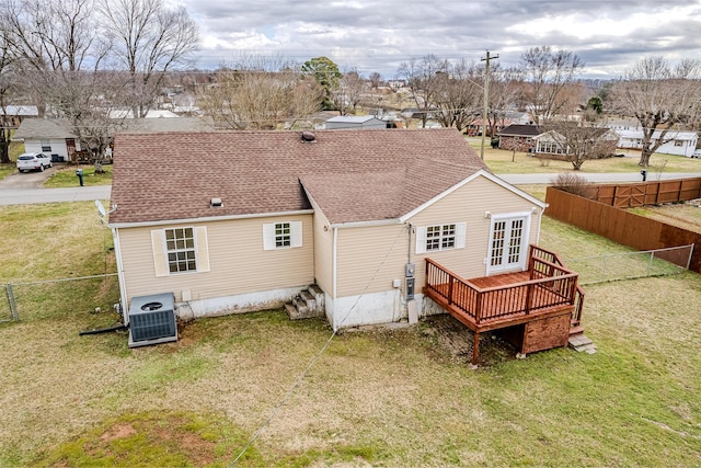 rear view of house with a yard, central AC, french doors, and a deck