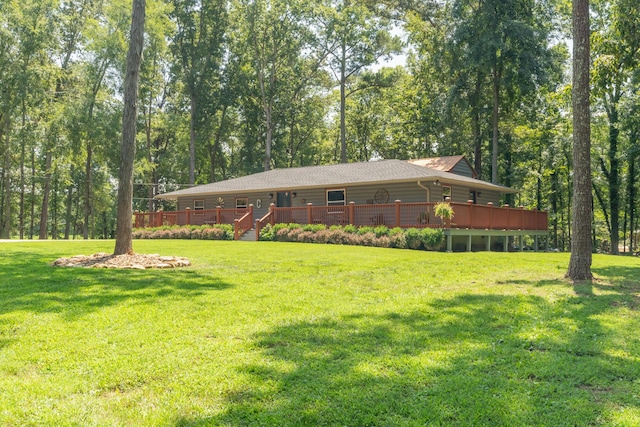 exterior space with a wooden deck and a front yard