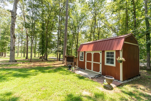 view of outbuilding with a yard