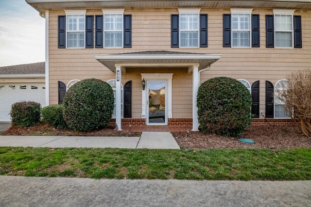 entrance to property featuring a garage