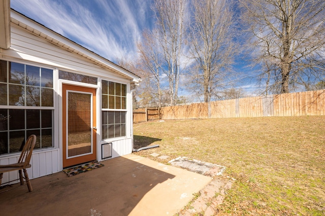 view of yard with a patio area and a fenced backyard