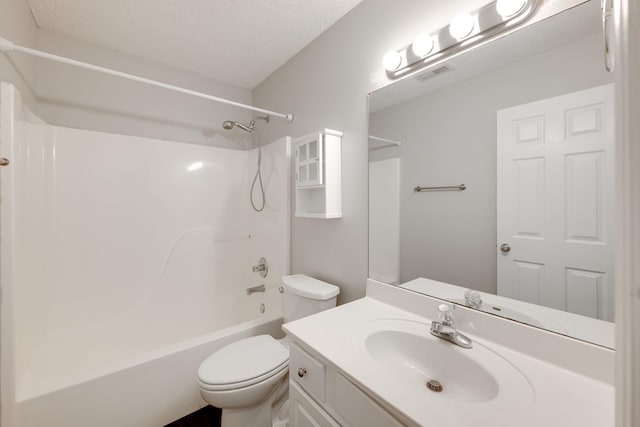 bathroom featuring bathtub / shower combination, visible vents, toilet, vanity, and a textured ceiling