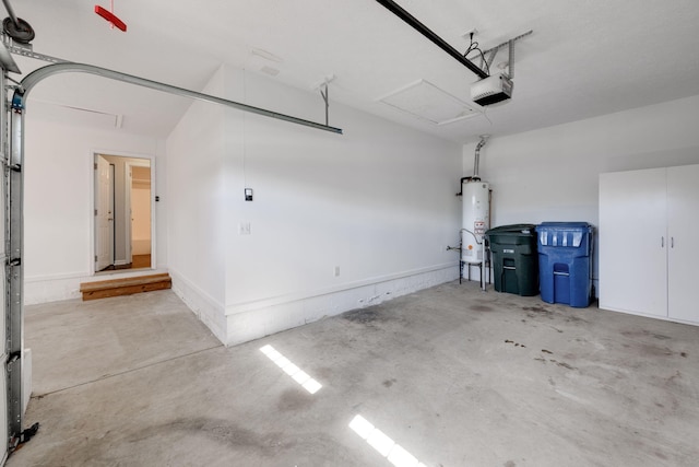 garage with gas water heater and a garage door opener