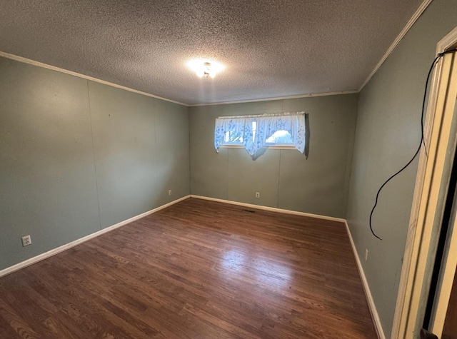 unfurnished room with dark wood-type flooring, ornamental molding, and a textured ceiling