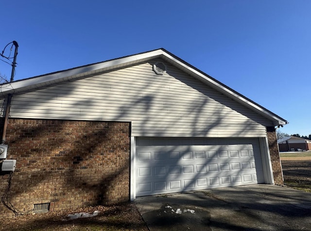 view of side of property with a garage