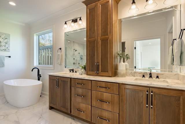 bathroom featuring a sink, baseboards, a freestanding bath, marble finish floor, and double vanity