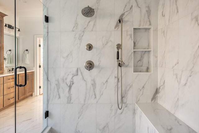 full bath with marble finish floor, vanity, and a marble finish shower