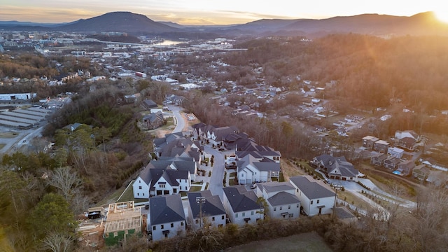 aerial view at dusk with a mountain view and a residential view