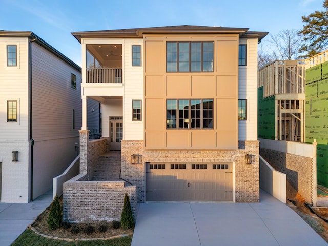 view of front of house with concrete driveway, brick siding, and an attached garage