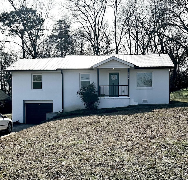 view of front of house with a garage and a porch