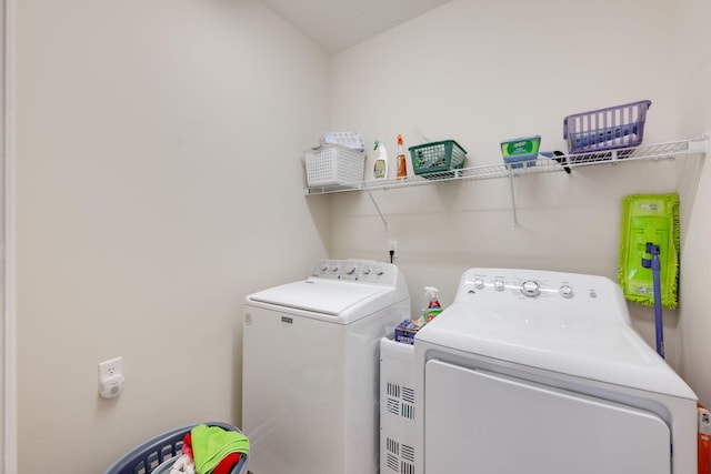 laundry room featuring separate washer and dryer