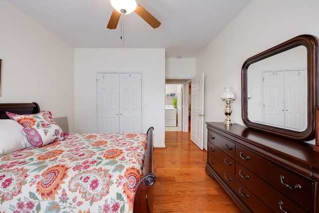 bedroom with ceiling fan, light wood-type flooring, a closet, and washer / dryer