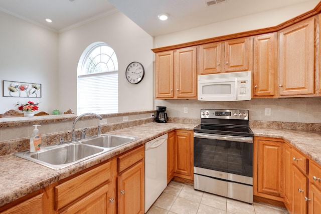 kitchen with white appliances, decorative backsplash, crown molding, light tile patterned floors, and sink
