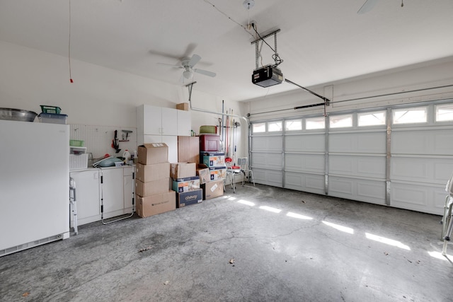 garage with ceiling fan, a garage door opener, and white refrigerator