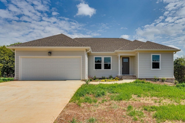 ranch-style house with a shingled roof, driveway, and a garage