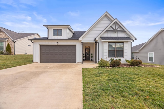 view of front of property featuring a garage and a front lawn