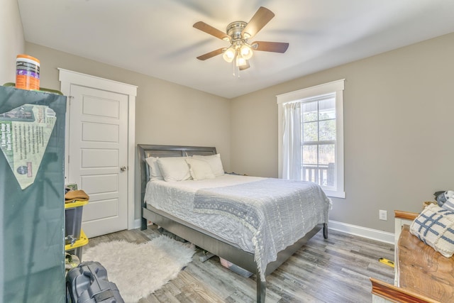 bedroom featuring ceiling fan and hardwood / wood-style floors