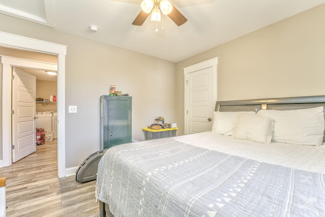 bedroom with washer and dryer, ceiling fan, and light wood-type flooring