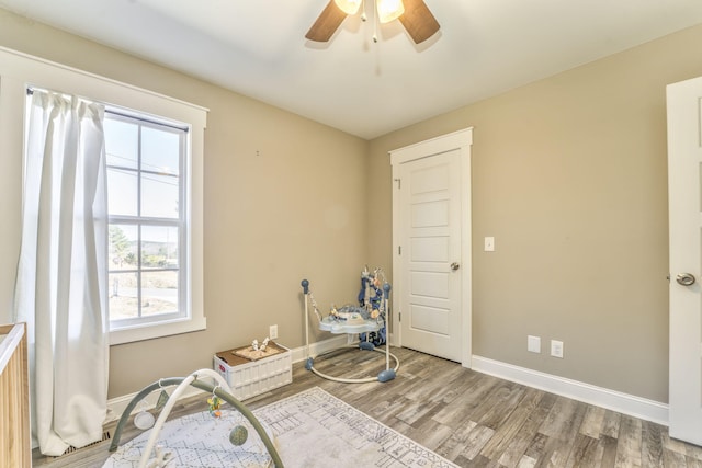 miscellaneous room featuring wood-type flooring and ceiling fan