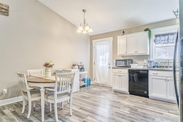 kitchen featuring black appliances, a chandelier, pendant lighting, light hardwood / wood-style floors, and white cabinets