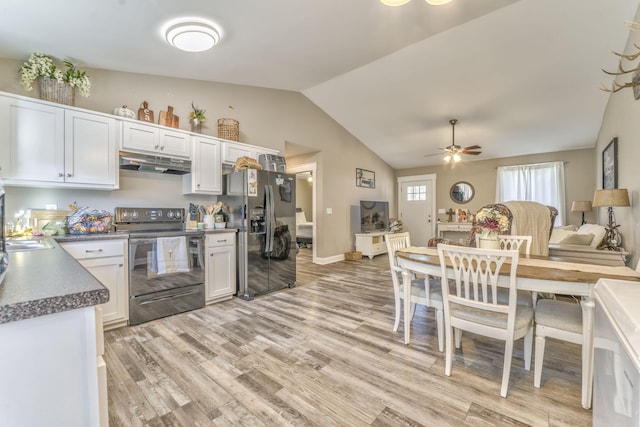 kitchen with vaulted ceiling, black / electric stove, white cabinets, refrigerator with ice dispenser, and light hardwood / wood-style flooring