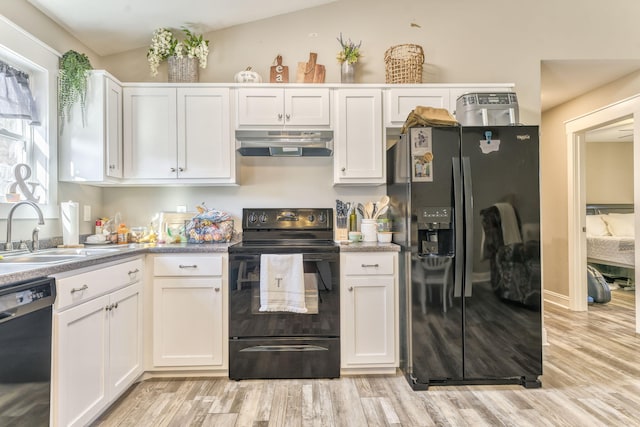 kitchen featuring sink, light hardwood / wood-style flooring, white cabinets, and black appliances